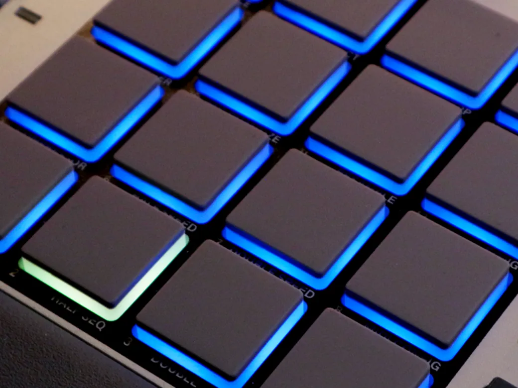 The lit drum pads of the Akai MPC Sample